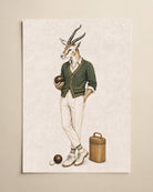 A vertical art print featuring an illustrated gazelle dressed in vintage sportswear, including a green cardigan, cream trousers, white shoes, and holding a bowling ball, shown against a warm beige background.