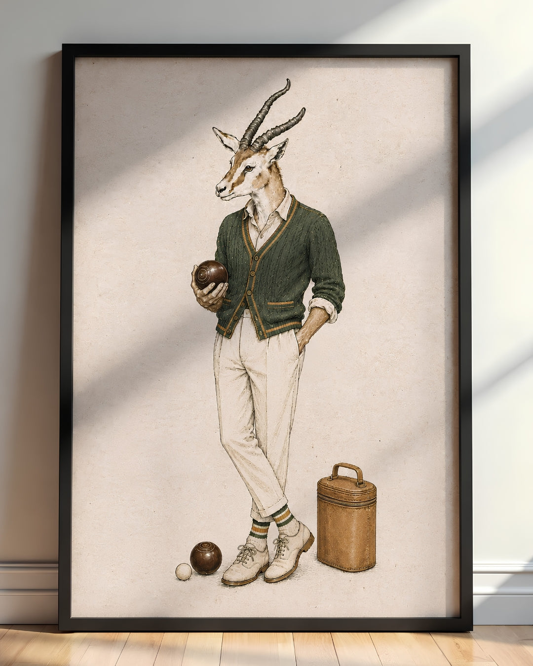A framed art print featuring a whimsical illustration of a gazelle dressed in vintage menswear with a bowler hat, standing next to a wooden case and bowling balls on a textured beige background.