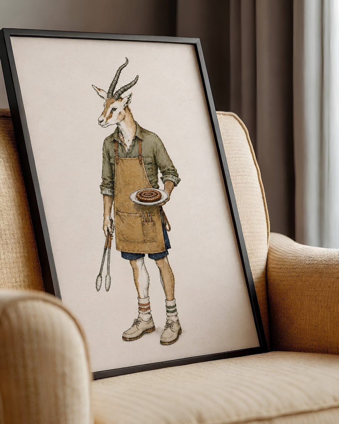 A framed art print featuring a whimsical illustration of a gazelle dressed as a chef, leaning against a beige armchair in a cozy room setting.
